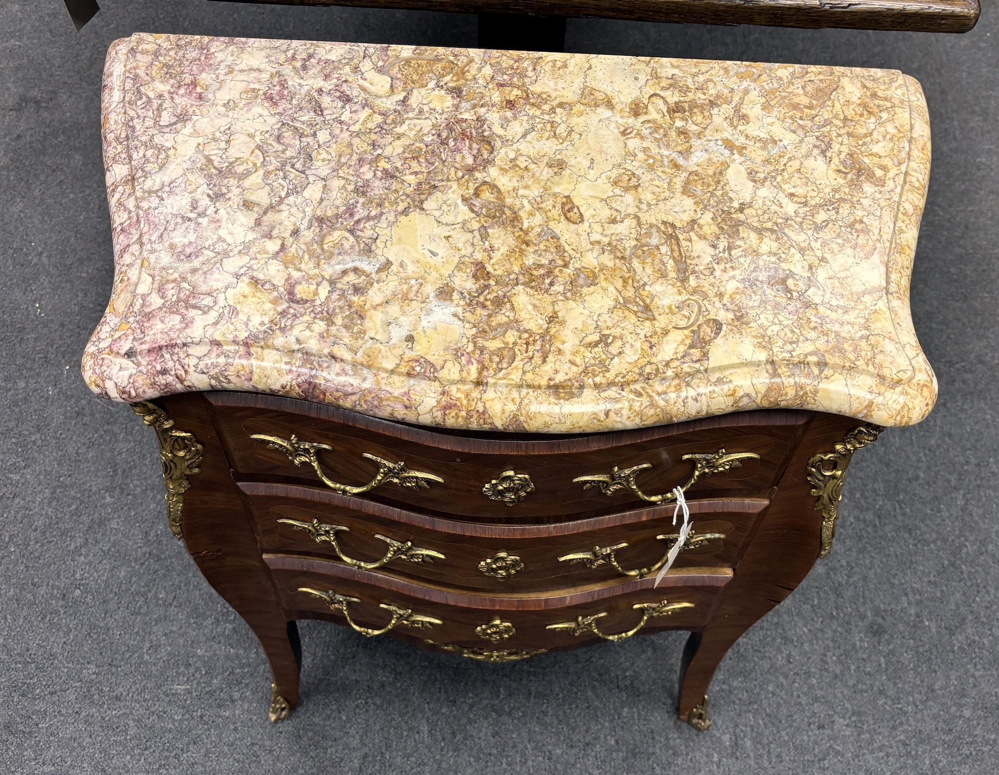 A Louis XV style gilt metal mounted marble topped serpentine petite commode, width 65cm, depth 34cm, height 74cm